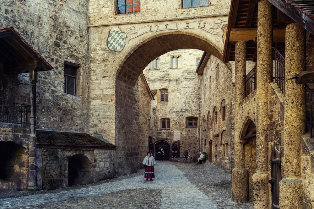 woman walking on archway