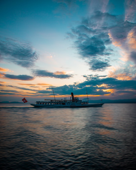 white ship on calm ocean in Lausanne Switzerland