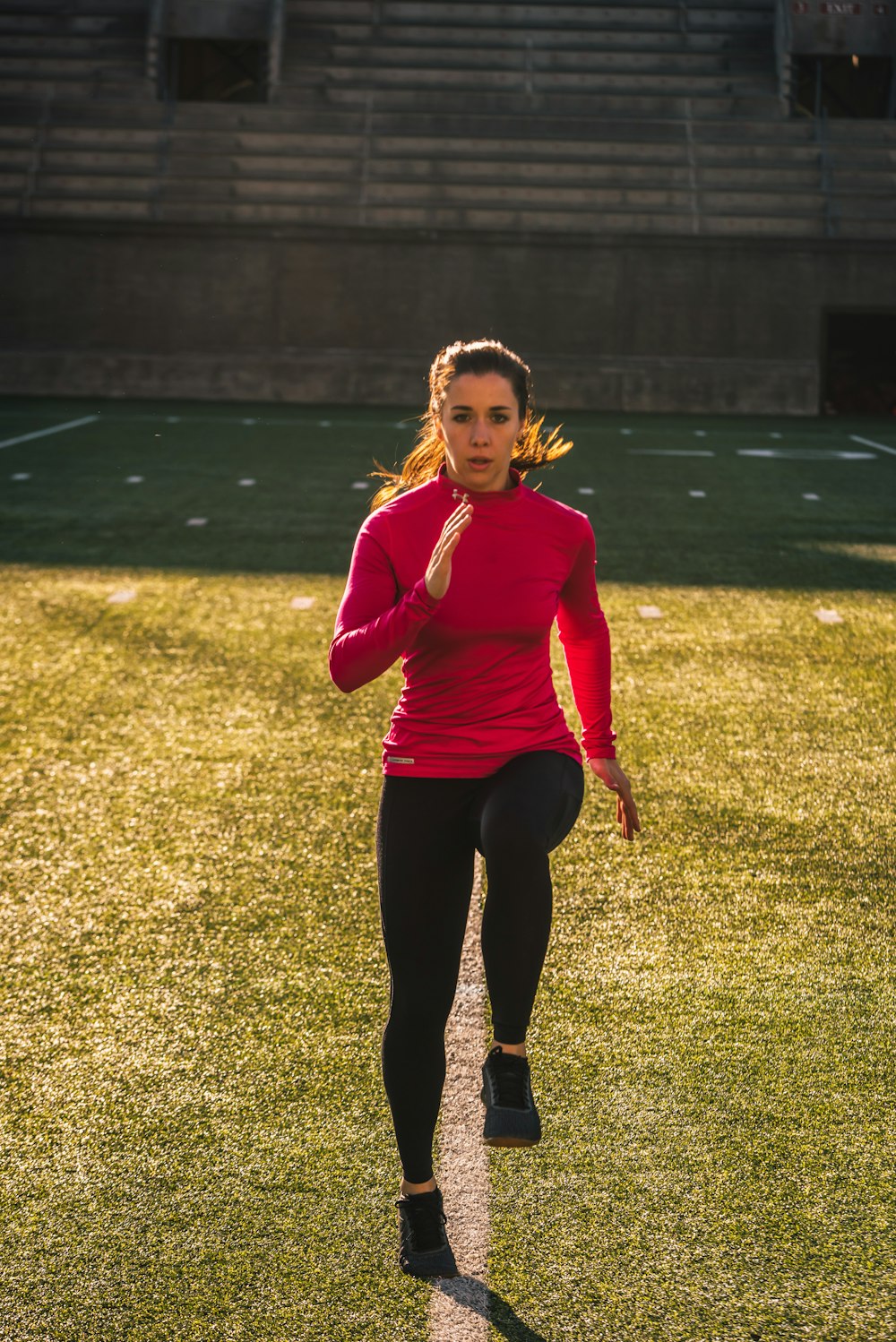 woman exercising on field
