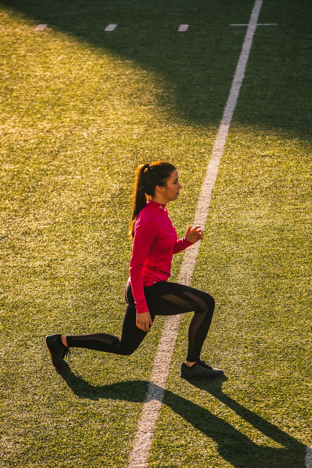 woman bending on field