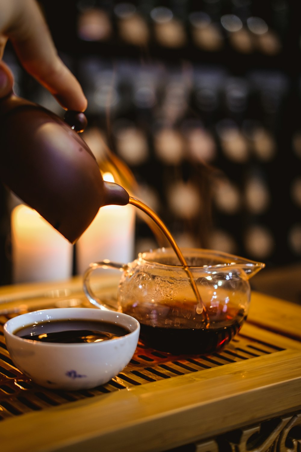 person holding brown teacup