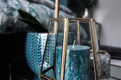 An artistic arrangement of evimel candles, highlighting the deep teal and vibrant teal colors.