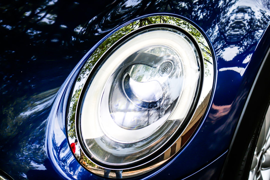 blue vehicle headlight during daytime