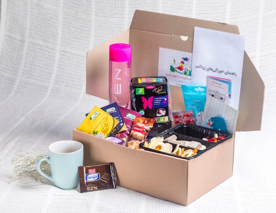 A vibrant subscription box overflowing with colorful items like snacks, stationery, and self-care products.