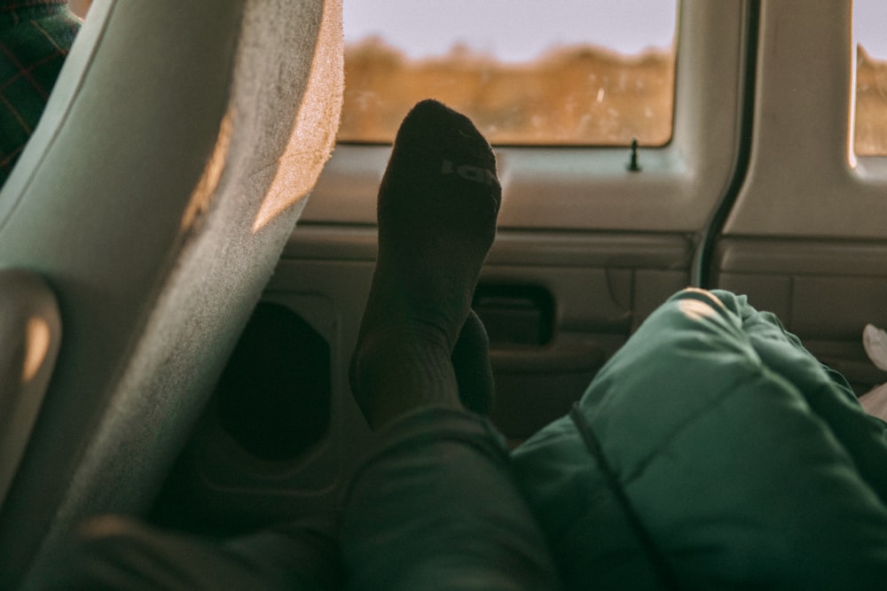 person lying down in vehicle