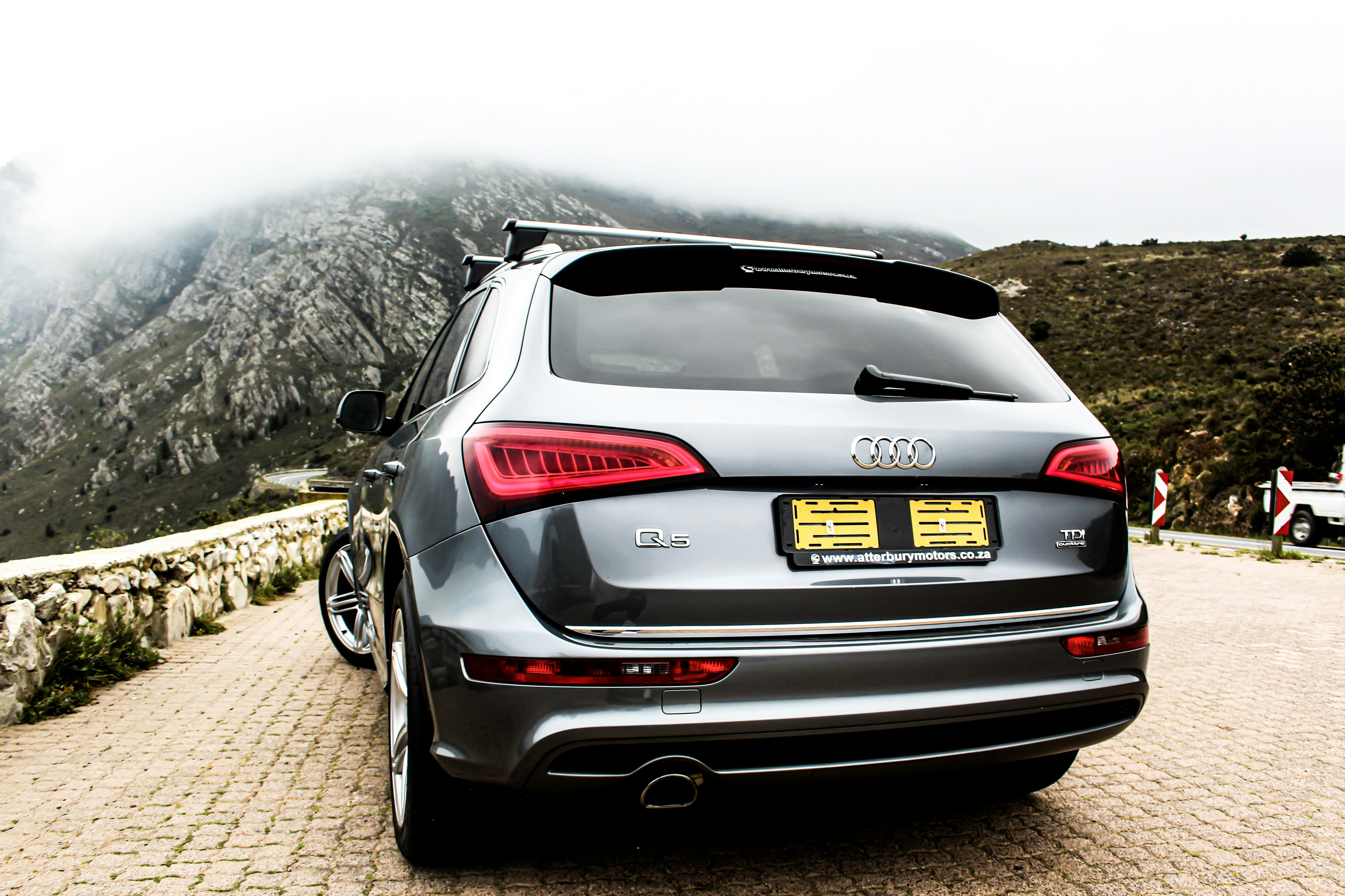 Grey Audi Q5 SUV on mountain road in Cape Town