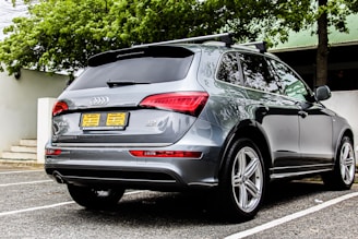 A shiny SUV parked at the airport ready for rental pickup.