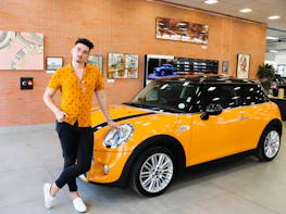 Friendly Excelsior Auto LLC team member ready to assist a customer.