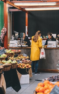 woman at the cashier inside fruits and vegetables store