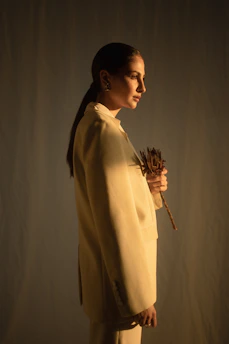 woman holding dried flower