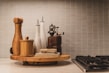 Close-up of elegant kitchen gadgets and tools displayed on a wooden countertop.