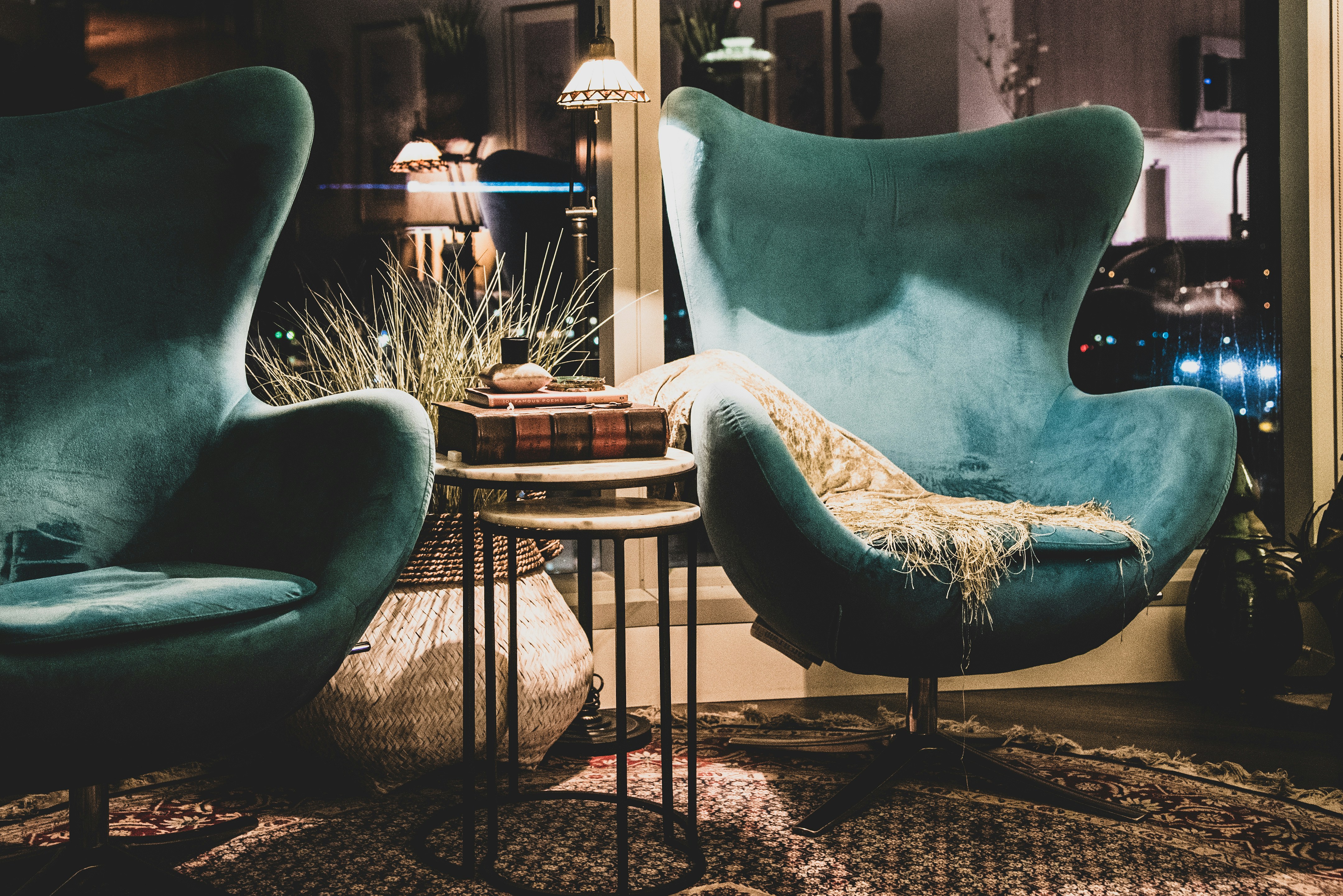 a living room with two chairs and a table, 