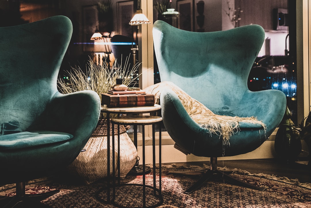 a living room with two chairs and a table,