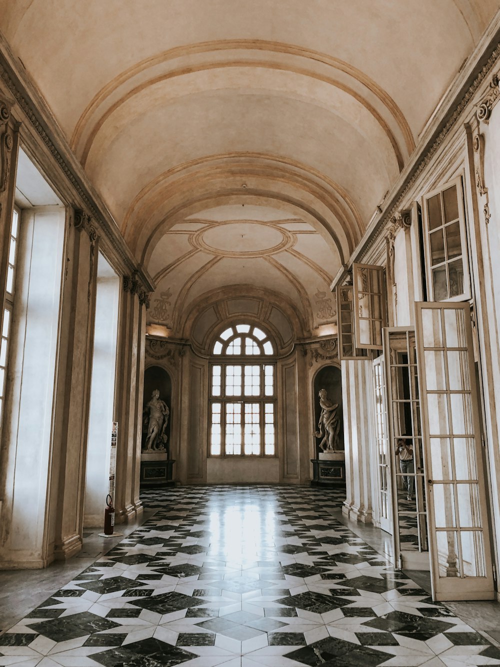 a large room with a black and white checkered floor