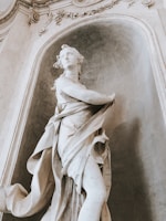 Elegant charcoal sketch of a softly draped classical figure.