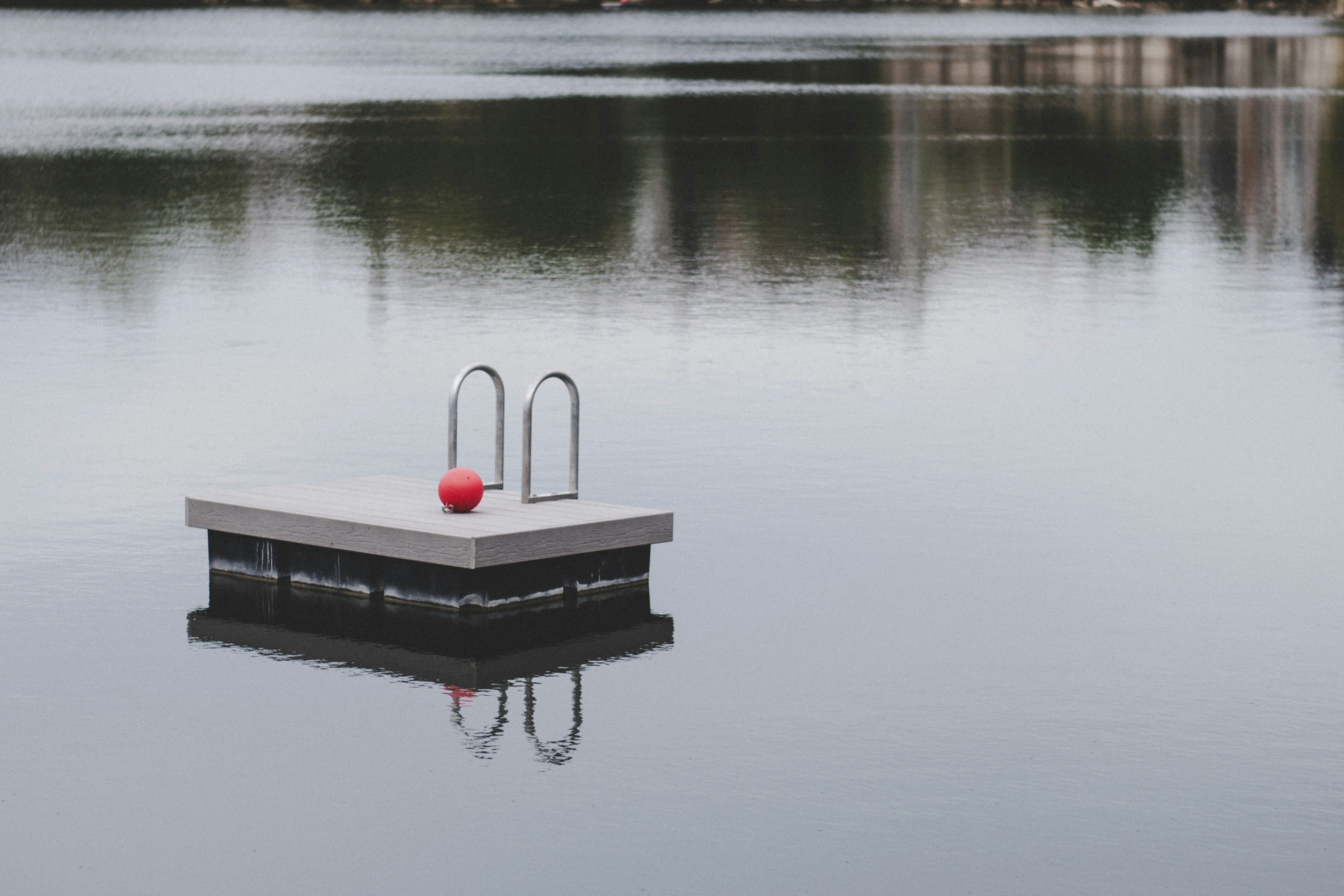 red ball on gray concrete pavement