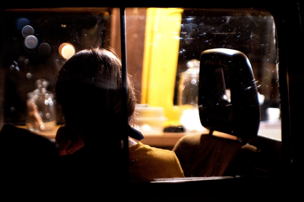 woman sitting in car seat