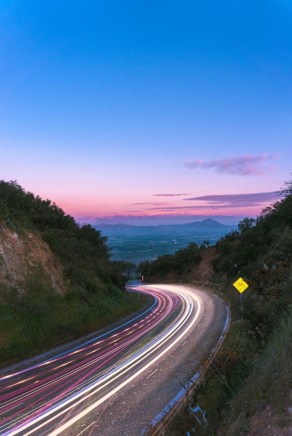 time-lapse photography of vehicle during golden hour