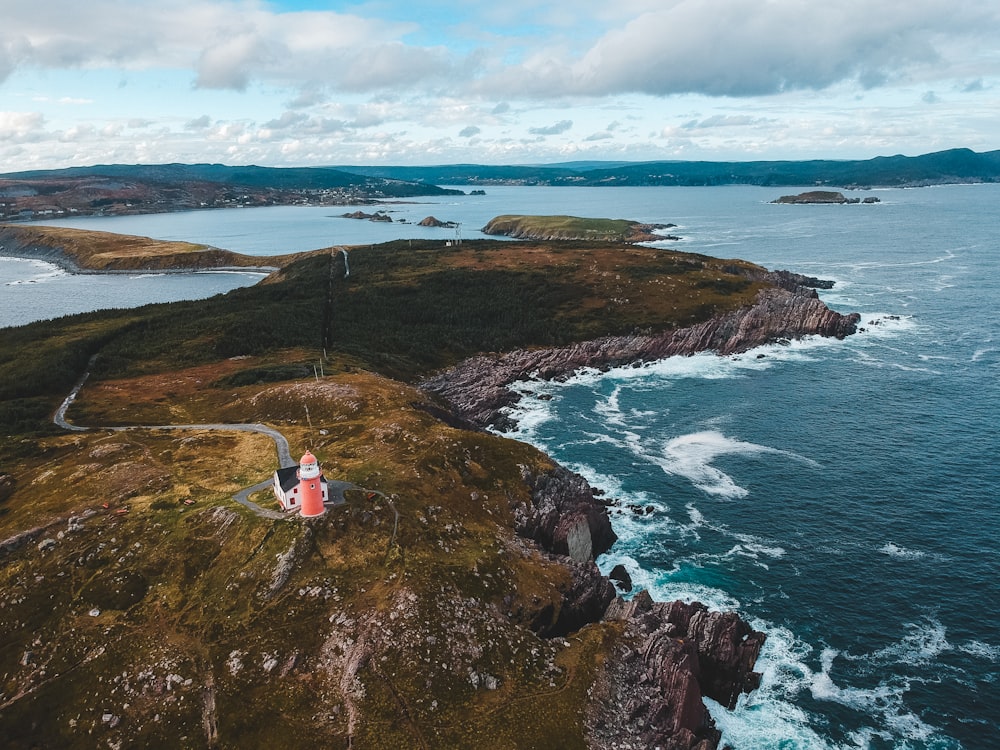 red lighthouse during daytime