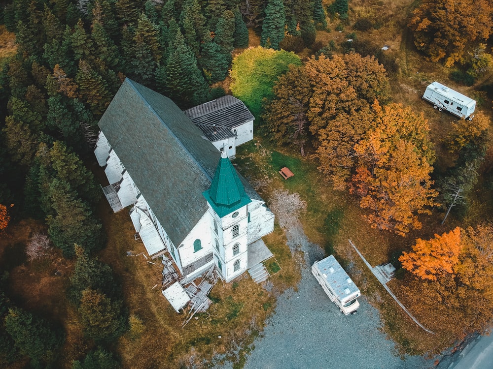 aerial view of white concrete building and trees