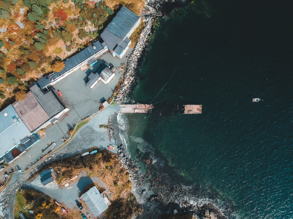 aerial photography of buildings beside sea during daytime