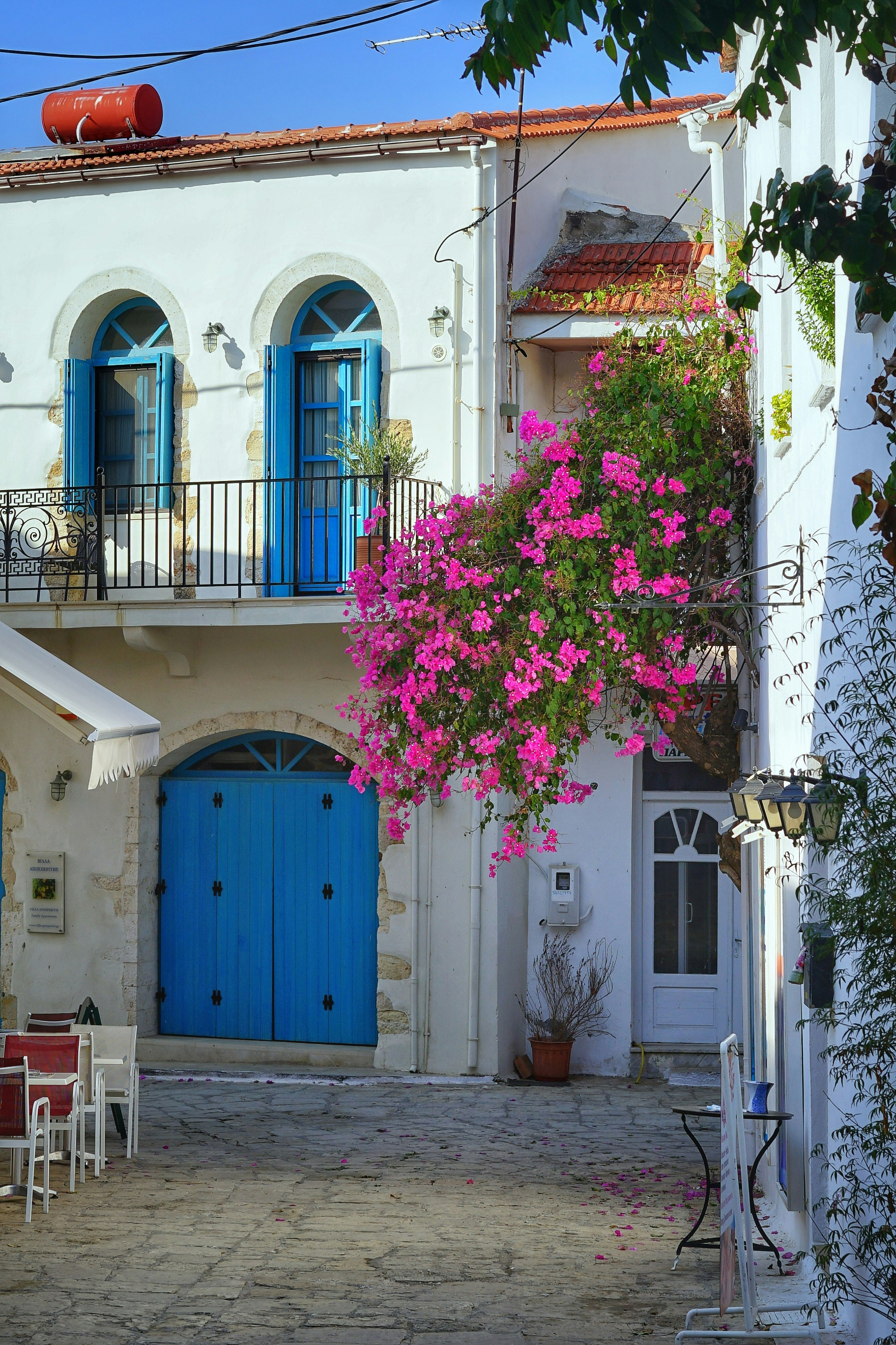 white and blue 2-storey house