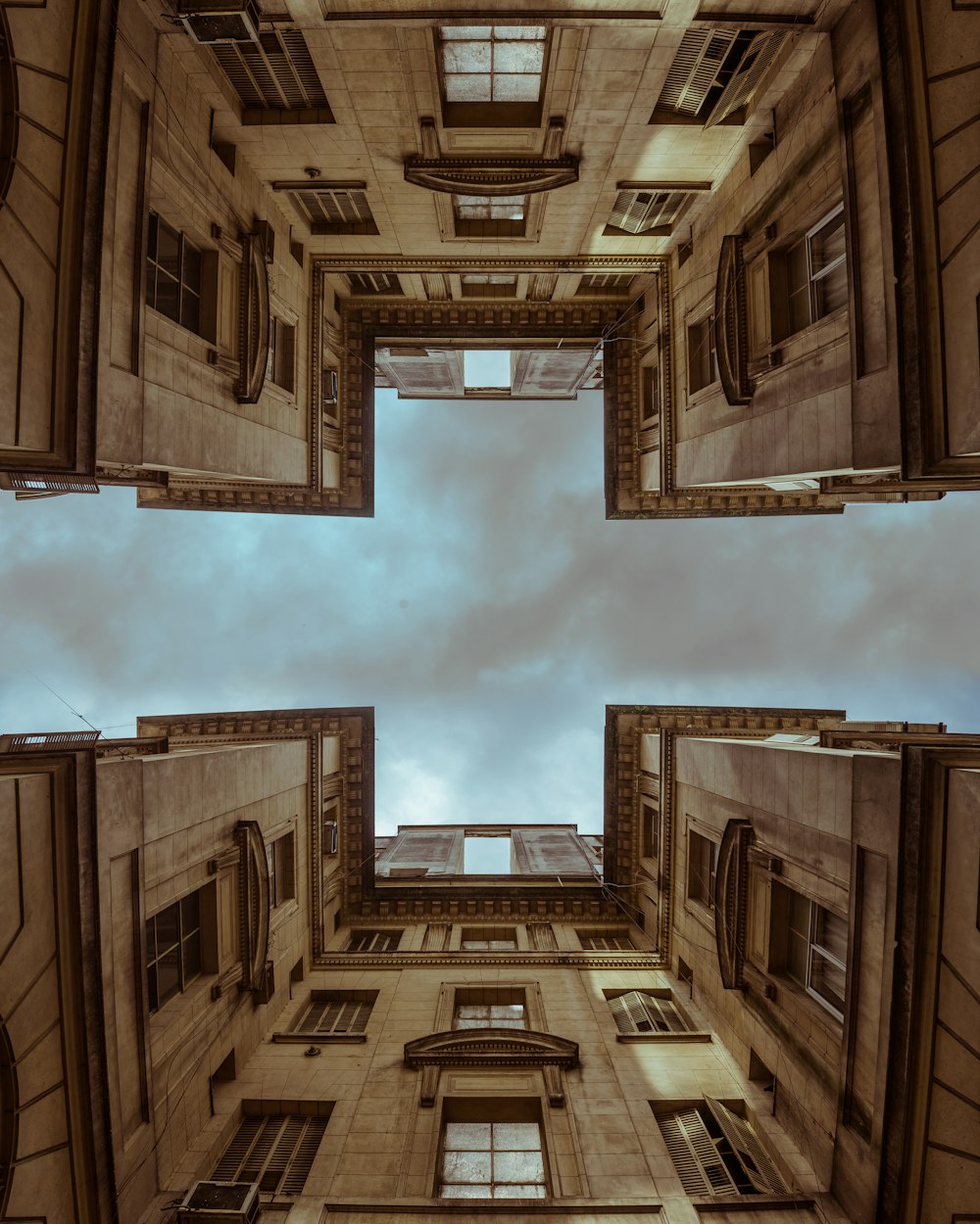 two brown concrete high rise buildings