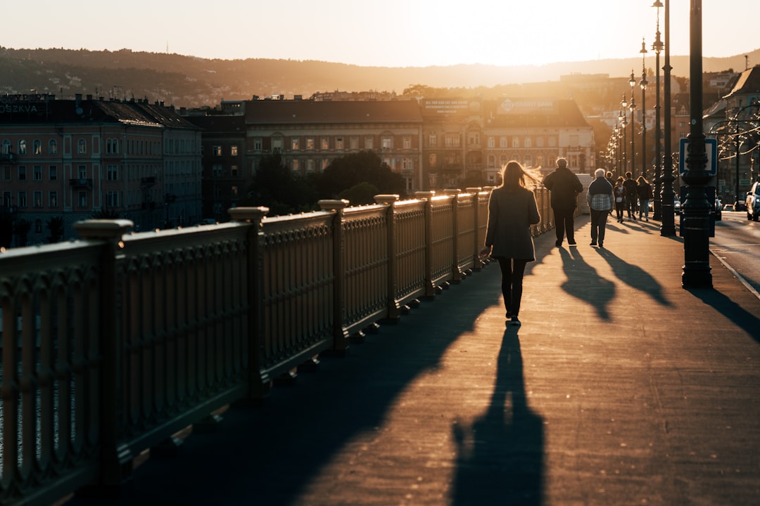 people walking on sidewalk during daytime