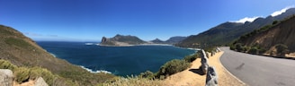 A panoramic view of the Australian coastline captured from a cliffside stop on their journey.