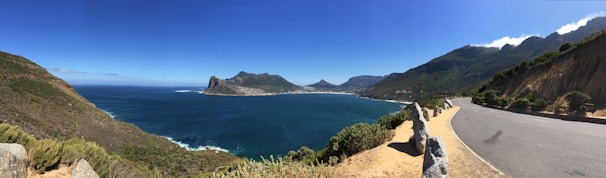 A panoramic view of the Australian coastline captured from a cliffside stop on their journey.