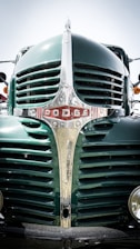 A close-up photo of a powerful truck grille shining under sunlight.