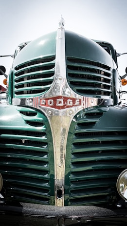 A close-up photo of a powerful truck grille shining under sunlight.