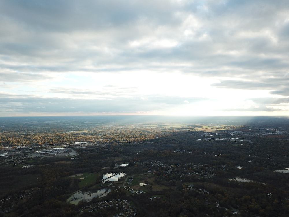 aerial photography of field under white and gray skies