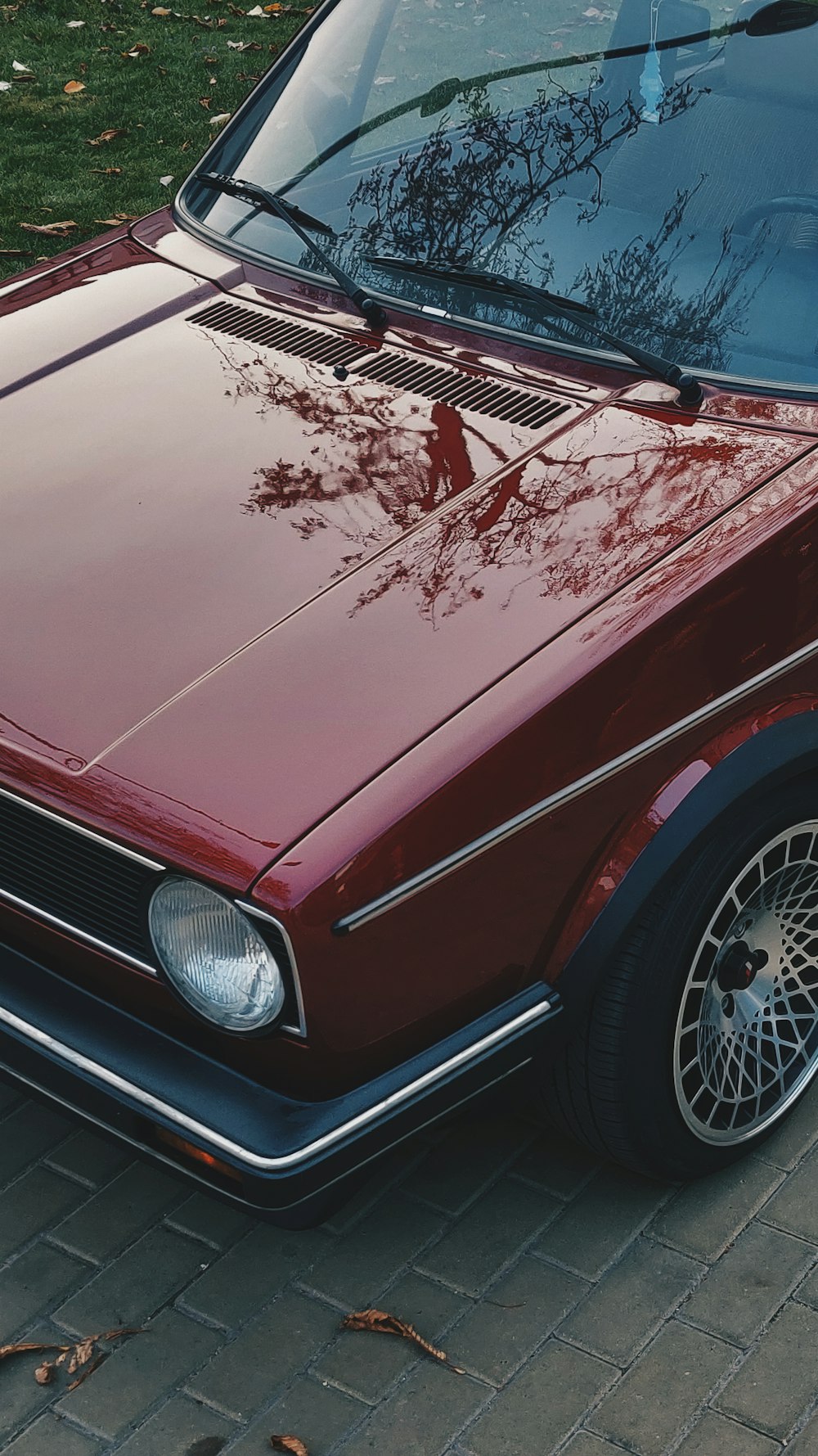 classic red car on brick road