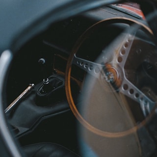 An Opel vintage gear shift knob with visible wear, showcasing its history.