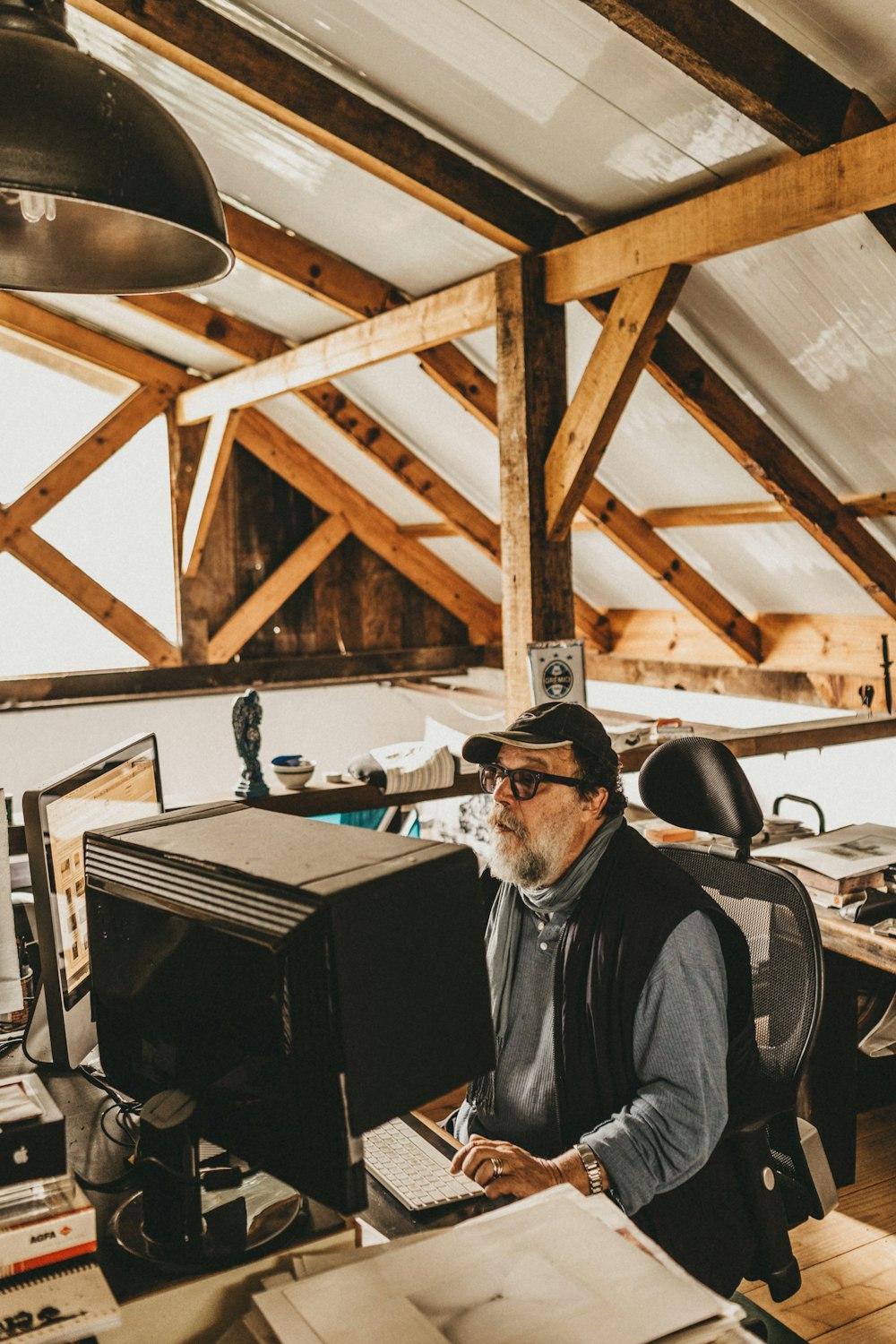 a man sitting at a desk with a computer