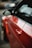 Close-up of a car door being repaired in a professional workshop.