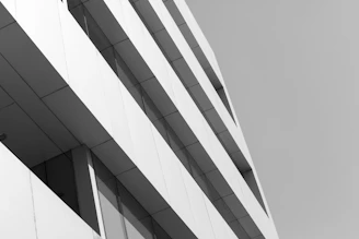 Abstract close-up of modern building facade emphasizing clean lines and calm atmosphere.