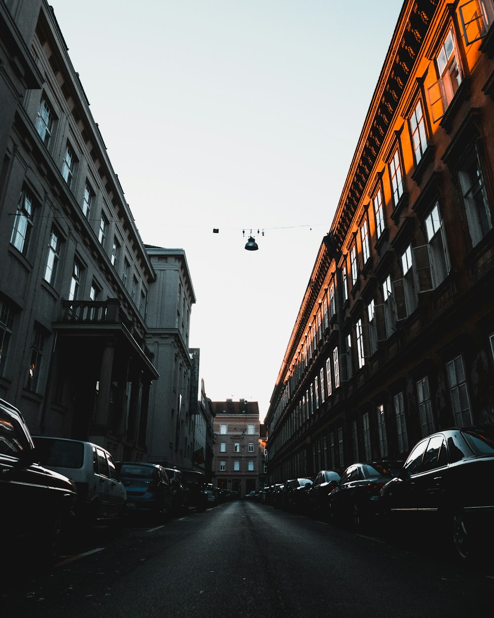 a street with cars parked on both sides of it