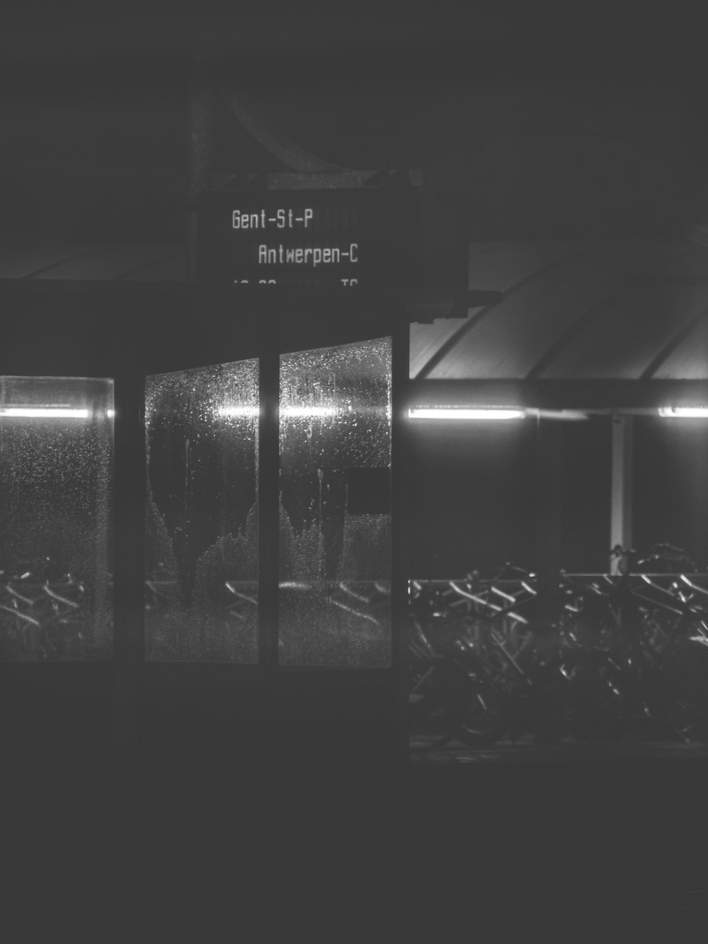 a black and white photo of a train station