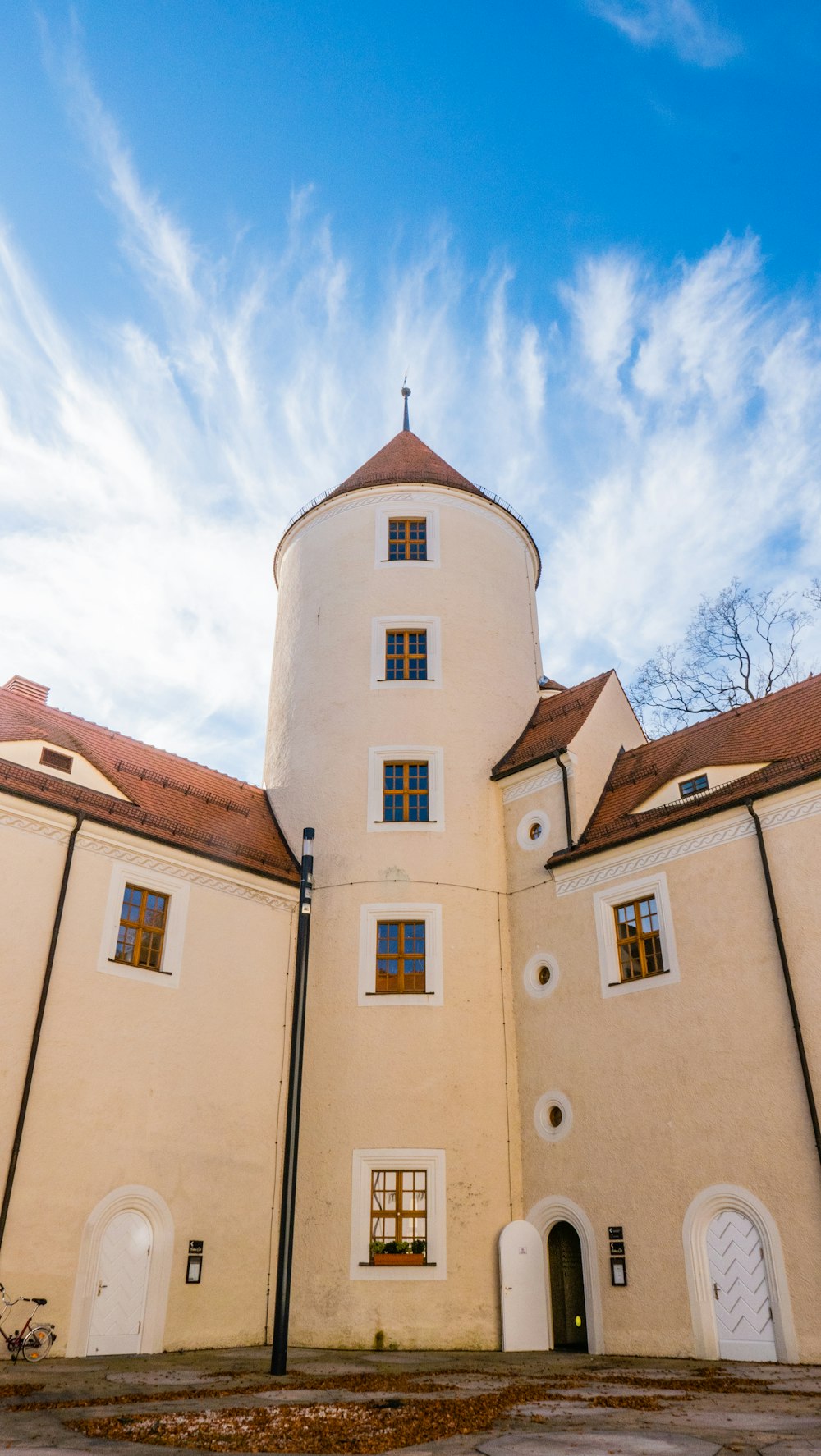 white painted building with tower view during daytime