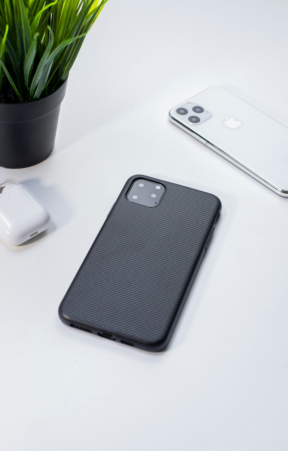 silver iPhone X Pro with case