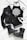 A stylish flat lay of fashion items including a black leather jacket, a black halter top with a white intricate mandala design, black denim shorts, lace-up black combat boots with studs, a pair of black sunglasses, and black bangles. The items are arranged on a white cloth background.