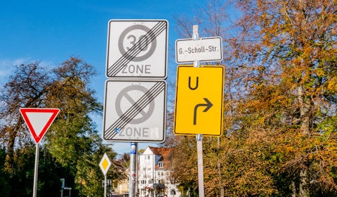 zone and u-turn road signs