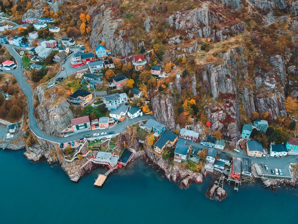 aerial photography of houses and buildings near blue body of water during daytime