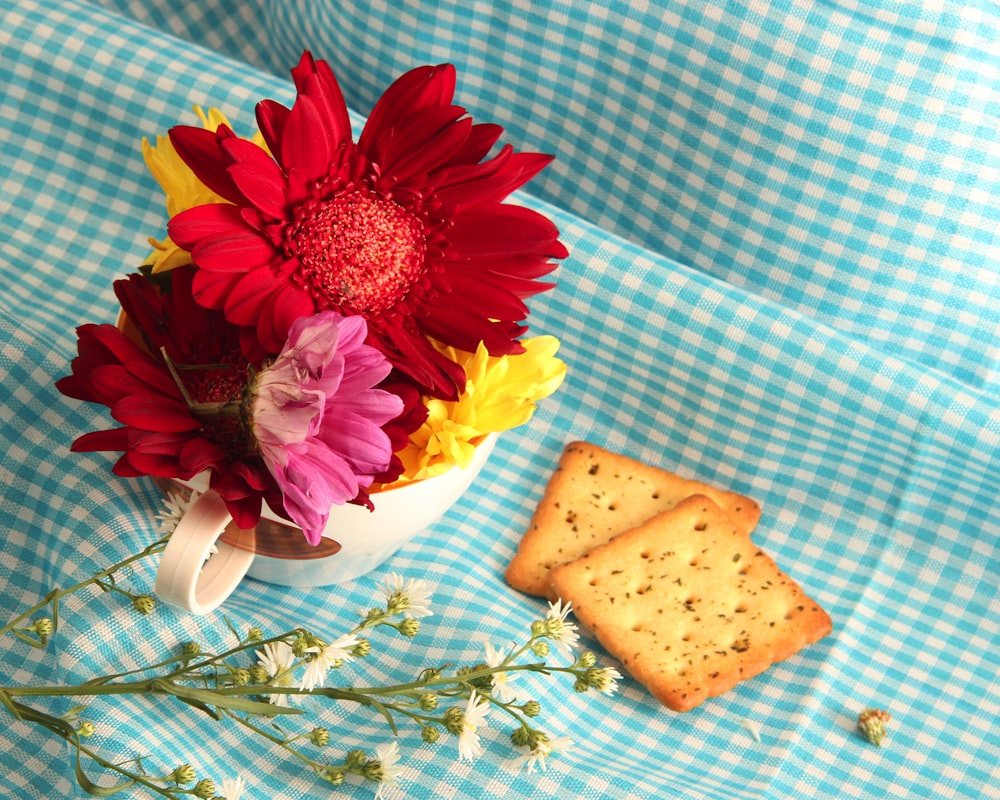 two biscuits beside flowers