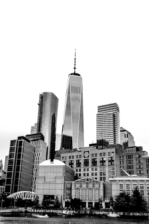 A minimalist black and white cityscape highlighting architectural lines.
