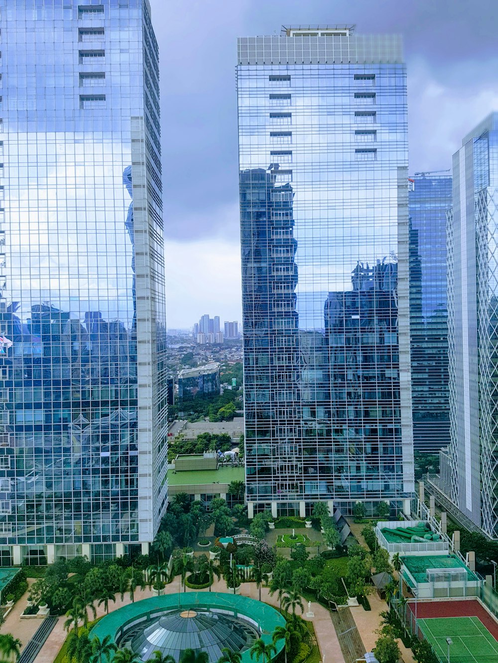 aerial photography of city with high-rise buildings under blue and white sky during daytime