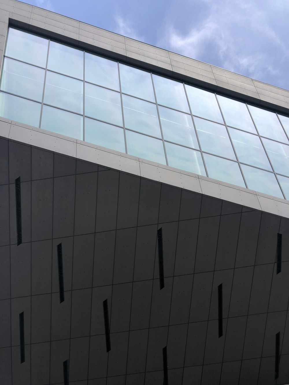 a tall building with a sky in the background