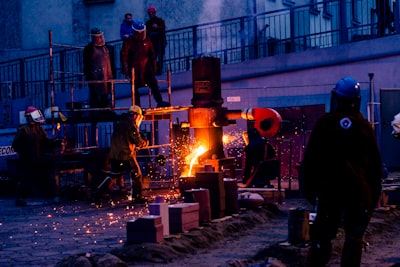 a group of people standing around a fire